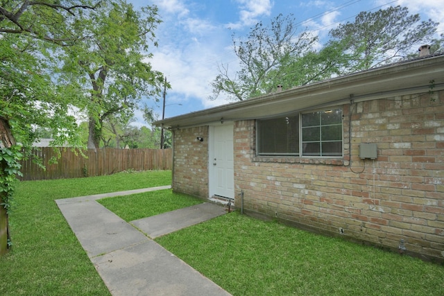 doorway to property with brick siding