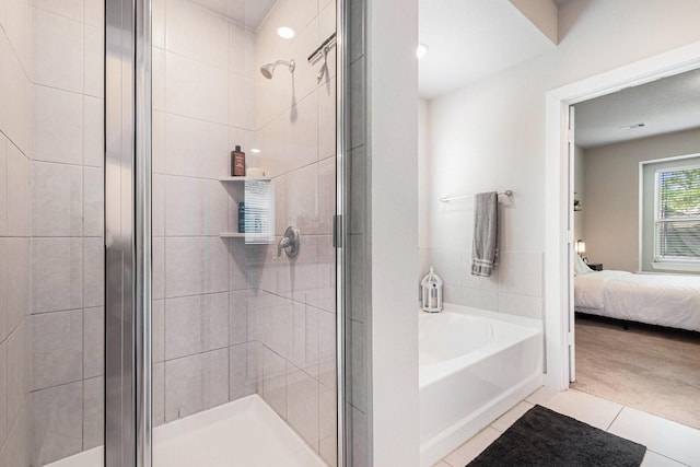 226 Aster View Ct, Montgomery, TX 77316 - bathroom featuring ensuite bathroom, a shower stall, tile patterned flooring, and a bath
