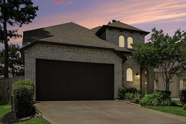 226 Aster View Ct, Montgomery, TX 77316 - french country inspired facade featuring driveway, an attached garage, brick siding, and a shingled roof
