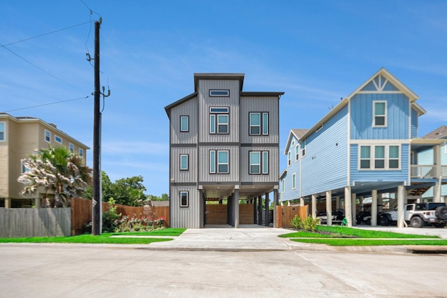 1501 Ashley Ct, Seabrook, TX 77586 - coastal inspired home with a carport, driveway, and fence