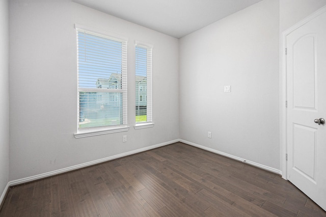 1501 Ashley Ct, Seabrook, TX 77586 - empty room featuring plenty of natural light, dark wood finished floors, and baseboards