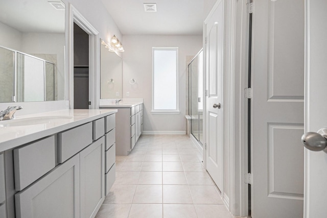 1501 Ashley Ct, Seabrook, TX 77586 - full bathroom with a shower stall, tile patterned flooring, two vanities, and baseboards