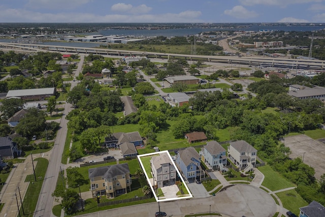 1501 Ashley Ct, Seabrook, TX 77586 - aerial overview of property's location with property parcel outlined, nearby suburban area, and a large body of water
