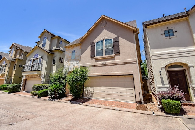 2612 Starboard Point Dr, Houston, TX 77054 - view of front of property with an attached garage, stucco siding, decorative driveway, and stone siding