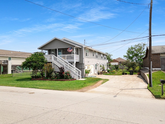 2120 73rd St, Galveston, TX 77551 - view of front of property featuring driveway, stairs, and a porch