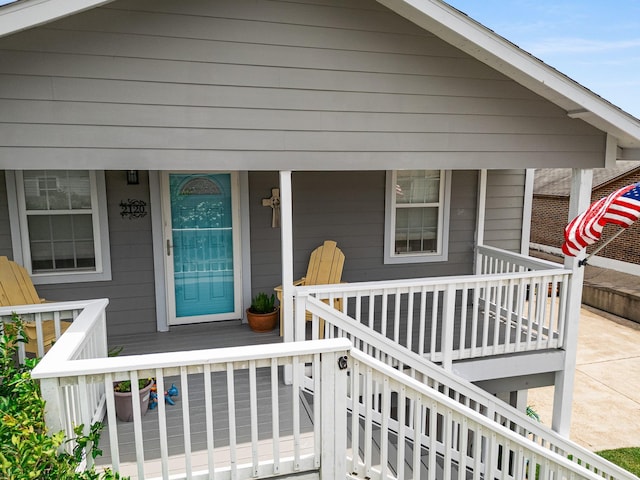 2120 73rd St, Galveston, TX 77551 - doorway to property featuring covered porch