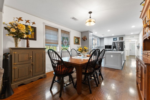 2120 73rd St, Galveston, TX 77551 - dining area featuring dark wood-type flooring
