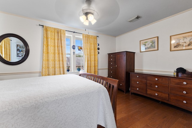 2120 73rd St, Galveston, TX 77551 - bedroom with dark wood-style flooring, ornamental molding, and a ceiling fan