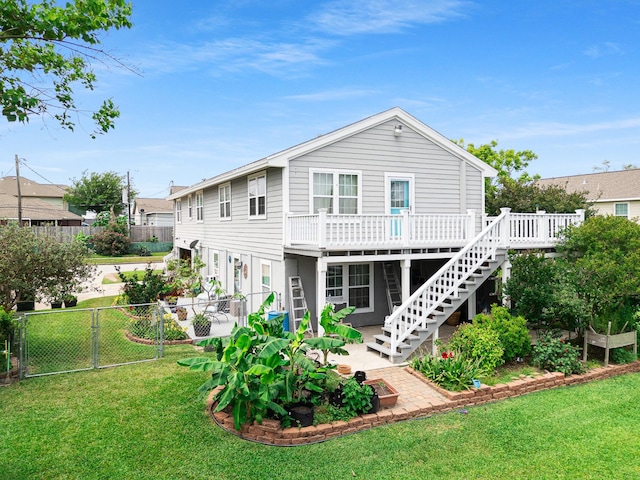 2120 73rd St, Galveston, TX 77551 - back of property featuring a deck, a patio area, and stairway