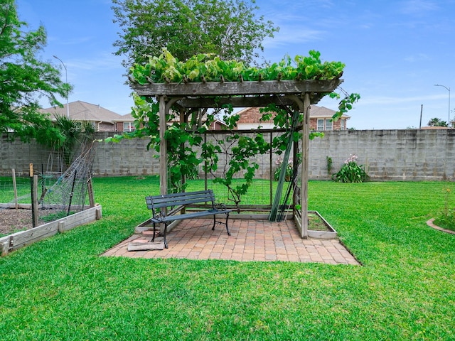 2120 73rd St, Galveston, TX 77551 - view of yard featuring a garden, a patio area, and a pergola