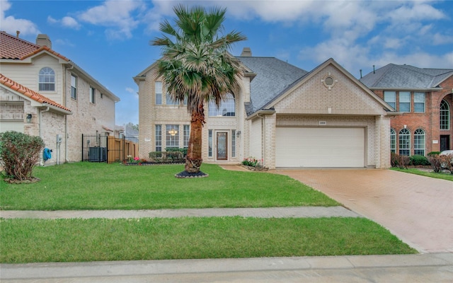 11939 Galentine Pt, Cypress, TX 77429 - view of front facade with a garage, brick siding, driveway, and a gate