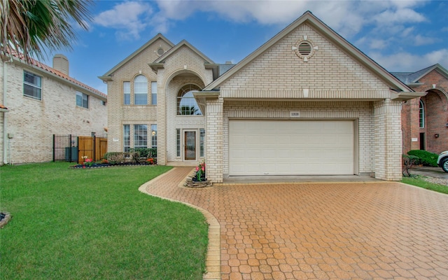11939 Galentine Pt, Cypress, TX 77429 - view of front facade with brick siding, decorative driveway, an attached garage, and a gate