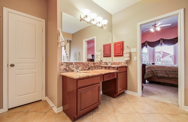 11939 Galentine Pt, Cypress, TX 77429 - bathroom featuring ensuite bathroom, double vanity, baseboards, tile patterned flooring, and a ceiling fan