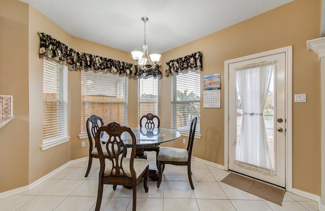 11939 Galentine Pt, Cypress, TX 77429 - dining space featuring a chandelier, baseboards, and light tile patterned floors