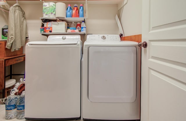11939 Galentine Pt, Cypress, TX 77429 - clothes washing area with washing machine and clothes dryer