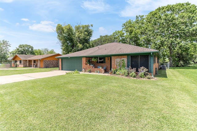 1448 Camellia Dr, Sweeny, TX 77480 - view of front of home with a garage, driveway, a front lawn, brick siding, and central AC unit