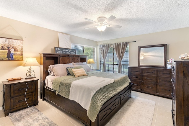 1448 Camellia Dr, Sweeny, TX 77480 - bedroom with light tile patterned floors, a textured ceiling, and a ceiling fan
