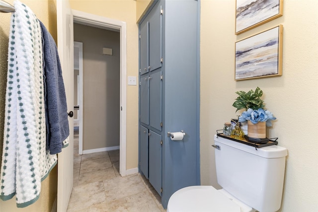 1448 Camellia Dr, Sweeny, TX 77480 - bathroom featuring toilet, tile patterned flooring, and baseboards