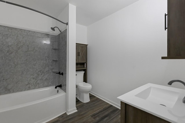 639 Manor St, Houston, TX 77015 - unfurnished bedroom featuring multiple closets, dark wood-style floors, and baseboards