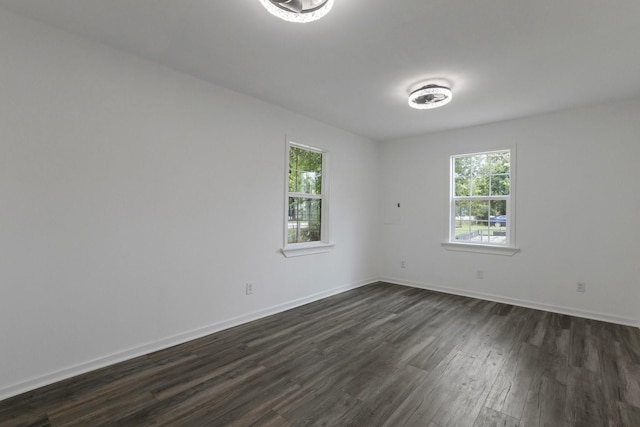 639 Manor St, Houston, TX 77015 - living area featuring a barn door, dark wood-style floors, and a chandelier