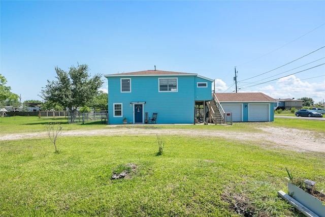 1619 Fm 517th Rd E, San Leon, TX 77539 - rear view of house with stairs, a garage, and an outdoor structure