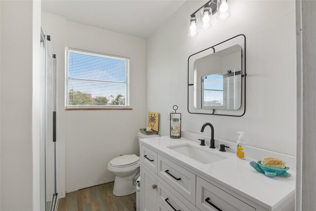 1619 Fm 517th Rd E, San Leon, TX 77539 - full bath with wood finished floors, vanity, toilet, and a shower