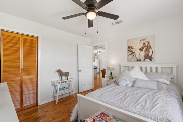 1619 Fm 517th Rd E, San Leon, TX 77539 - bedroom with wood finished floors, a closet, baseboards, and a ceiling fan
