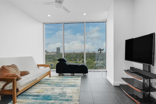 living area with expansive windows, ceiling fan, recessed lighting, and tile patterned floors