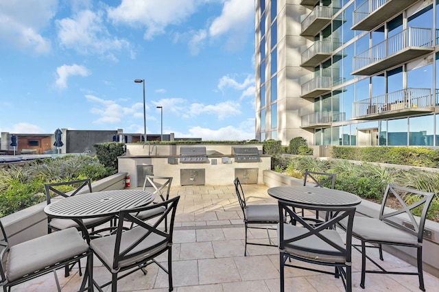 view of patio / terrace with an outdoor kitchen and a grill