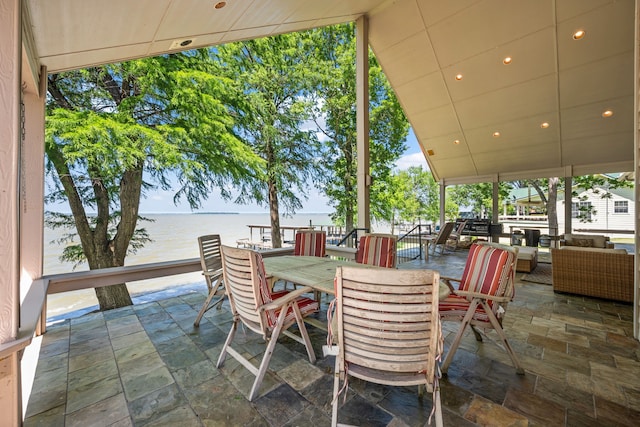 180 Hummel Ln, Coldspring, TX 77331 - view of patio / terrace with an outdoor living space, a water view, and outdoor dining space