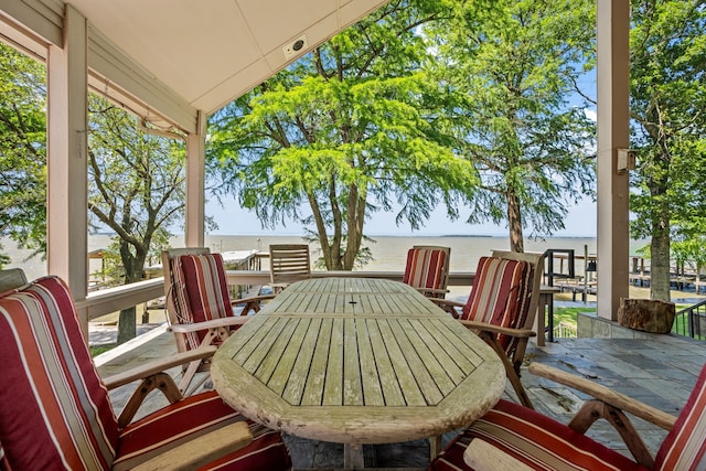 180 Hummel Ln, Coldspring, TX 77331 - view of patio / terrace featuring outdoor dining space and a water view