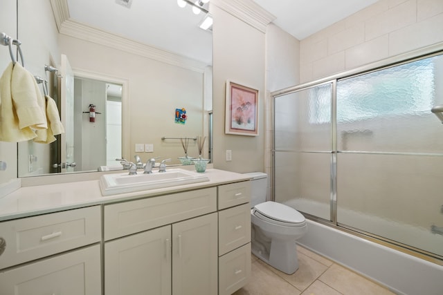 180 Hummel Ln, Coldspring, TX 77331 - bathroom featuring tile patterned floors, ornamental molding, toilet, vanity, and enclosed tub / shower combo