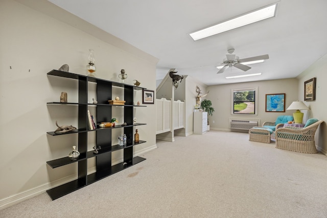 180 Hummel Ln, Coldspring, TX 77331 - living area featuring a skylight, carpet floors, and baseboards