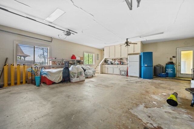 180 Hummel Ln, Coldspring, TX 77331 - garage with freestanding refrigerator and ceiling fan