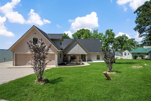 180 Hummel Ln, Coldspring, TX 77331 - view of front facade featuring concrete driveway, a front lawn, a shingled roof, and an attached garage
