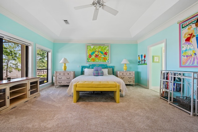 180 Hummel Ln, Coldspring, TX 77331 - bedroom featuring carpet floors, a tray ceiling, crown molding, and ceiling fan