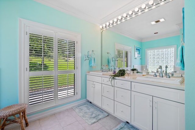 180 Hummel Ln, Coldspring, TX 77331 - bathroom featuring plenty of natural light, ornamental molding, tile patterned floors, double vanity, and baseboards