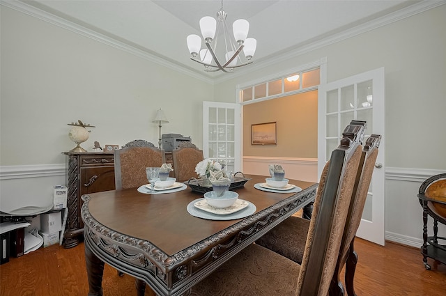 8946 Catamaran Way, Montgomery, TX 77316 - dining area with a chandelier, wood finished floors, and ornamental molding