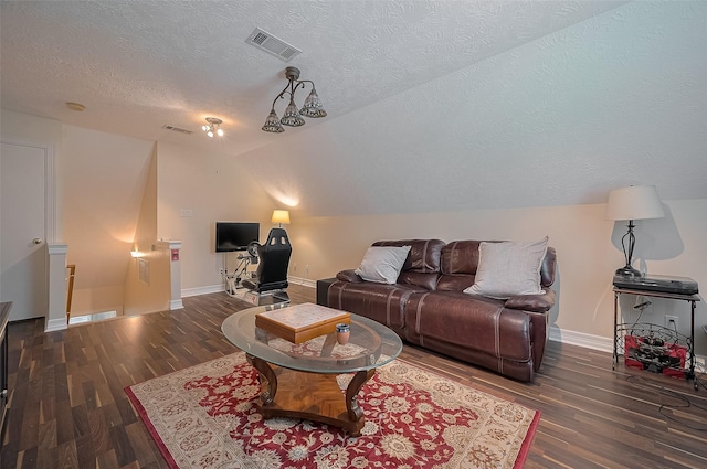 8946 Catamaran Way, Montgomery, TX 77316 - living room with lofted ceiling, a textured ceiling, wood finished floors, and baseboards