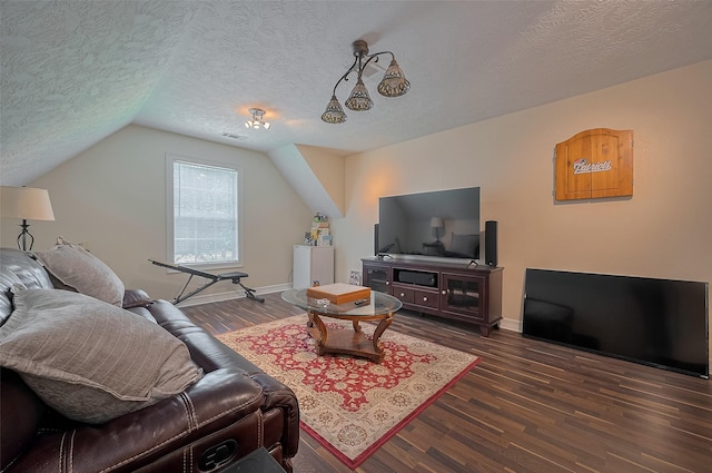 8946 Catamaran Way, Montgomery, TX 77316 - living room featuring a textured ceiling, wood finished floors, baseboards, and vaulted ceiling