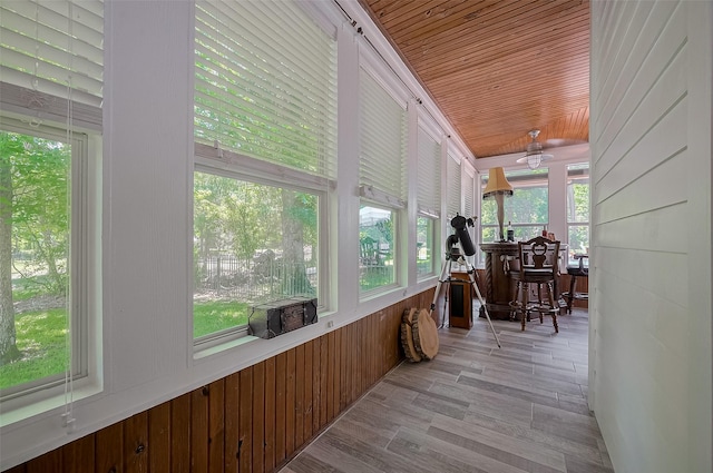 8946 Catamaran Way, Montgomery, TX 77316 - sunroom featuring healthy amount of natural light, wooden walls, wood finished floors, and wood ceiling