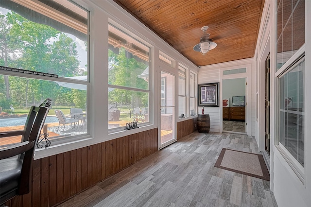 8946 Catamaran Way, Montgomery, TX 77316 - unfurnished sunroom with wood ceiling, wooden walls, and wood finished floors