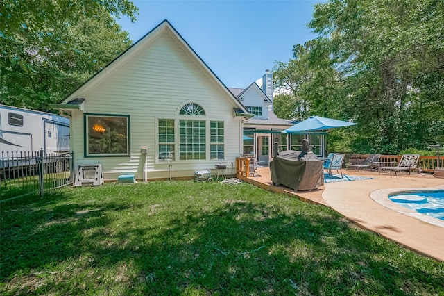 8946 Catamaran Way, Montgomery, TX 77316 - back of house with a chimney, a patio area, and a deck