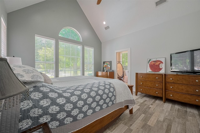8946 Catamaran Way, Montgomery, TX 77316 - bedroom featuring high vaulted ceiling, wood finished floors, and ceiling fan