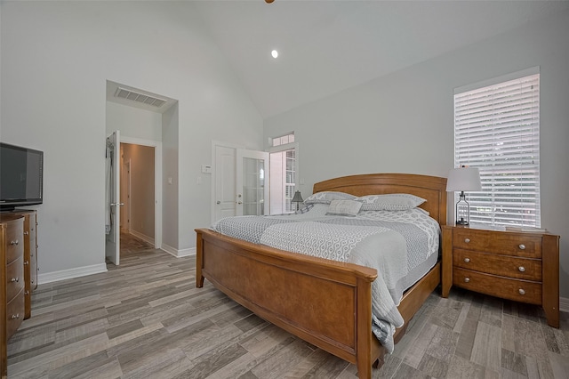 8946 Catamaran Way, Montgomery, TX 77316 - bedroom with high vaulted ceiling, wood finished floors, baseboards, and recessed lighting