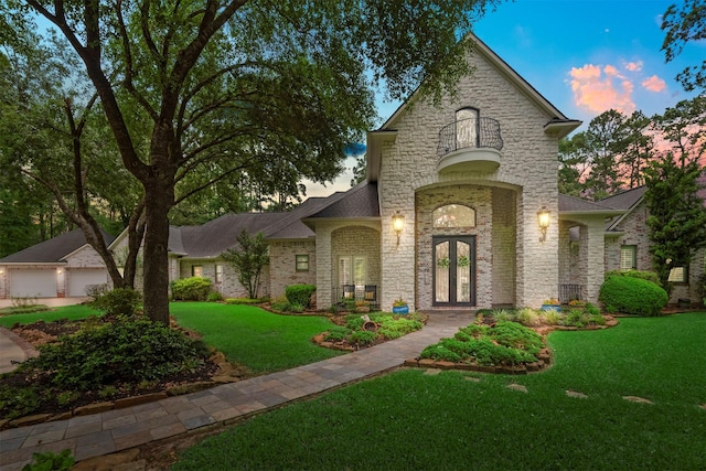 3706 Skyoak Ct, Spring, TX 77386 - french provincial home with french doors, a yard, and stone siding