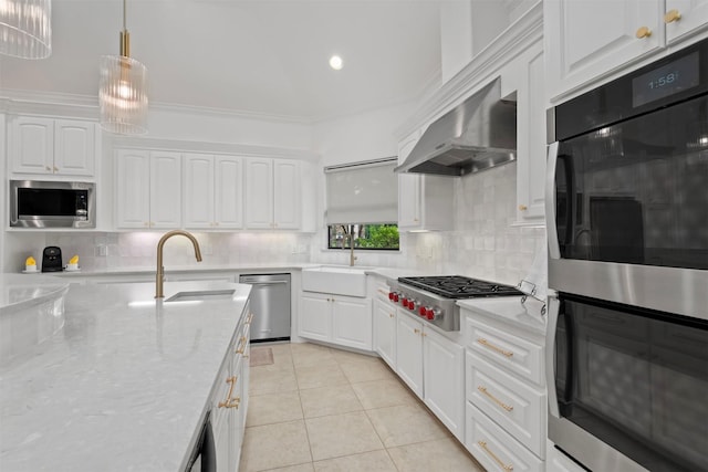 3706 Skyoak Ct, Spring, TX 77386 - kitchen featuring a sink, stainless steel appliances, white cabinetry, decorative backsplash, and recessed lighting