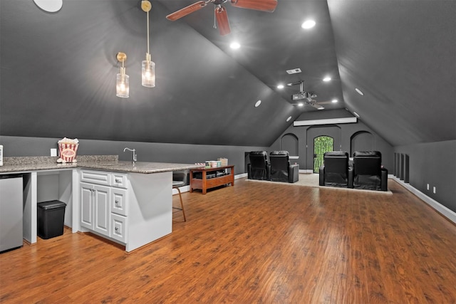 3706 Skyoak Ct, Spring, TX 77386 - cinema featuring ceiling fan, light wood-type flooring, vaulted ceiling, recessed lighting, and a sink