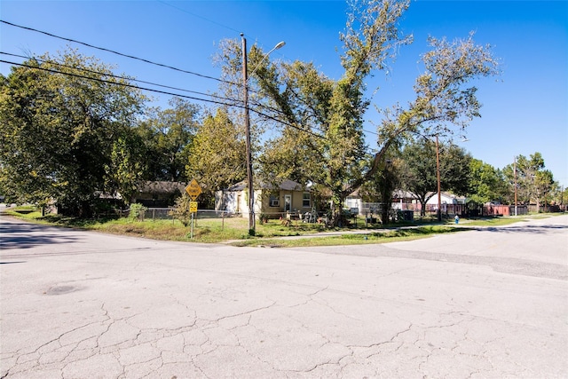 8101 Appleton St, Houston, TX 77022 - view of asphalt street with street lights, traffic signs, and a residential view