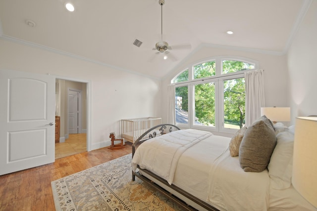 7527 Foster Island Dr, Richmond, TX 77406 - bedroom featuring crown molding, lofted ceiling, light wood-type flooring, baseboards, and a ceiling fan